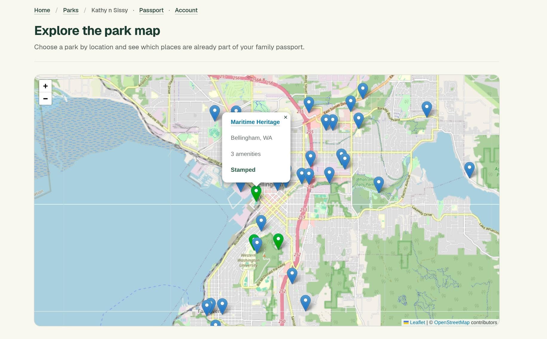 ParkQuest on desktop: the park atlas centered on Bellingham, Washington, with markers for parks, a selected Maritime Heritage park popup showing its amenities and stamped status, and zoom controls.